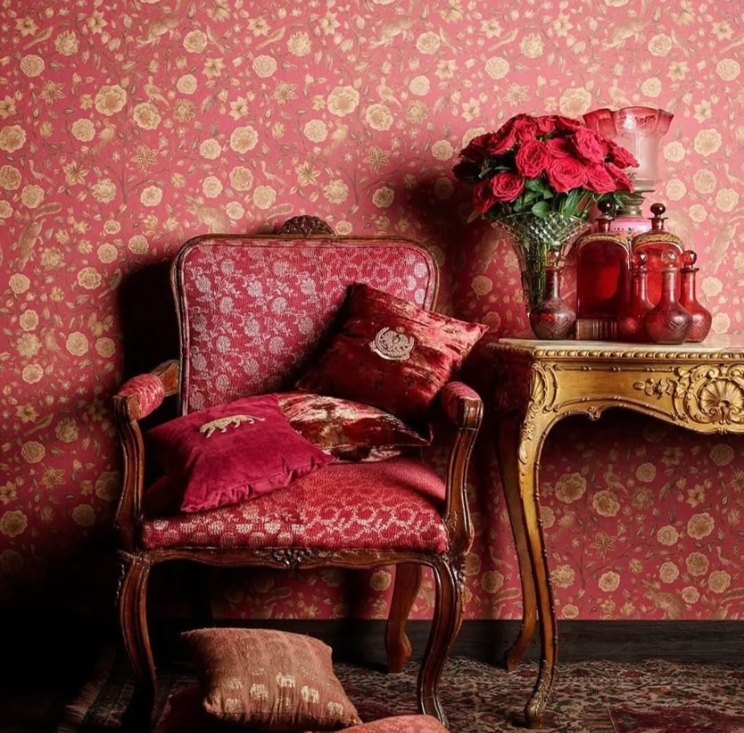A WALL BEHIND A SOFA WITH FABRIC NATION JAMMU WALLPAPERS USED